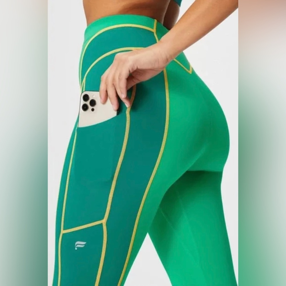 Fabletics green and yellow high waisted workout leggings with pockets